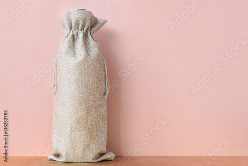 Minimalistic fall mockup with wine bag blank pink background. Subtle wine bag mock up. Autumn sale mock up. Ecology concept.