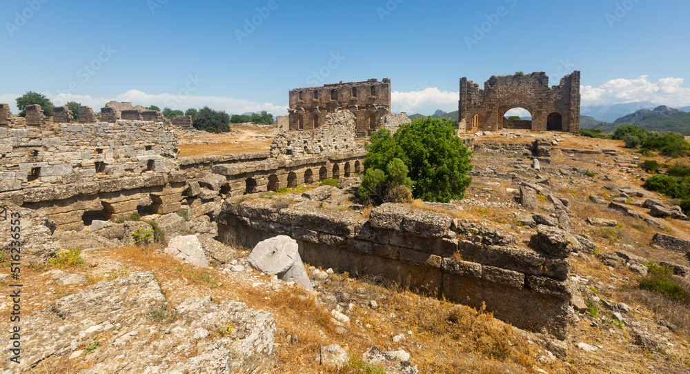 View of the ancient ruins of the roman bazilica and nymphaeum in the antiquity city of Aspendos, currently located near ..Antalya in the Serik district, Turkey