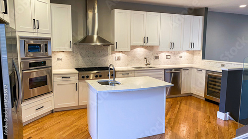 white cabinet with modern interior kitchen design, wood floors and backsplash tiles