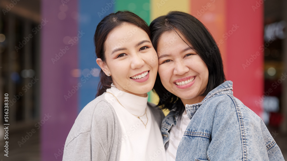 Young adult queer lover transgender asia two gay people fun happy enjoy relax look at camera. LGBT LGBTQIA beauty colorful flag color bisexual family festival hug love smile at city street town. Young adult queer lover transgender asia two gay people fun happy enjoy relax look at camera. LGBT LGBTQIA beauty colorful flag color bisexual family festival hug love smile at city street town.