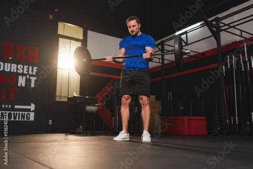 strong athlete man person exercising in modern sport gym, active workout exercise training in fitness studio for body strong power and heavy fit, bodybuilding and physical healthy lifestyle people