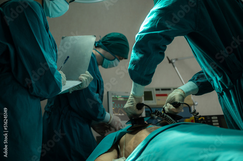 professional surgeon doctor teamwork person working in hospital operation room with surgery medical health equipment with surgical patient and nurse, emergency medicine treatment clinic concept