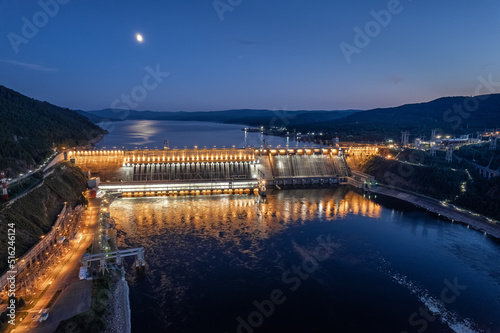 View of the hydroelectric dam on the river, shooting at night at long exposure