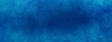 Blue paper background. Old vintage texture grunge design. Elegant dark blue center and light blue faded border.