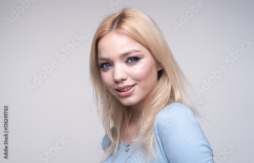 Young beautiful sensual woman with blue eyes. Woman with sexy lips. Portrait of happy young woman. Beauty skin woman with natural make up healthy unaltered skin.