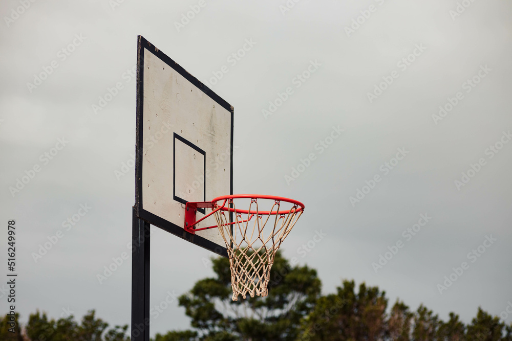 Basketball hoop used for recreation on a cloudy day