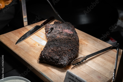 grilled meat on wooden board
