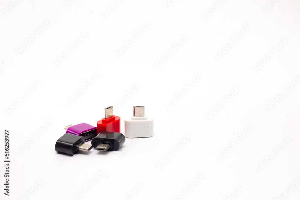 Fototapeta premium Otg cable adapters in a white background. OTG. on the go. copy space for products, cellphone accessories, power, technology and connections.