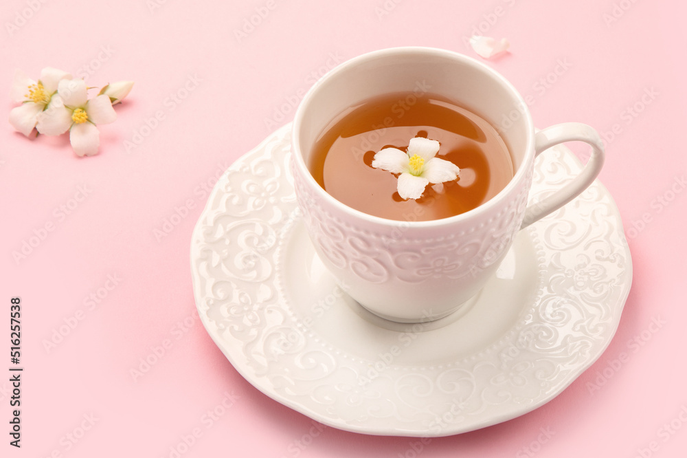Jasmine tea on color background.