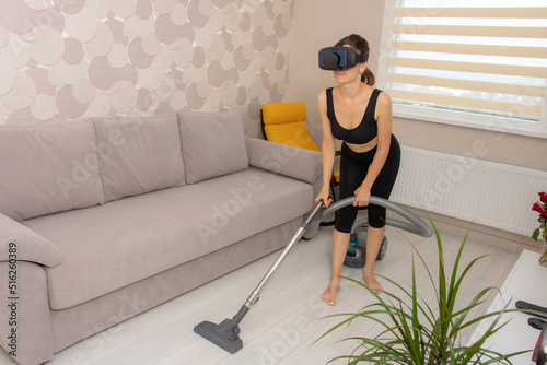 Woman cleans the house with vr glasses