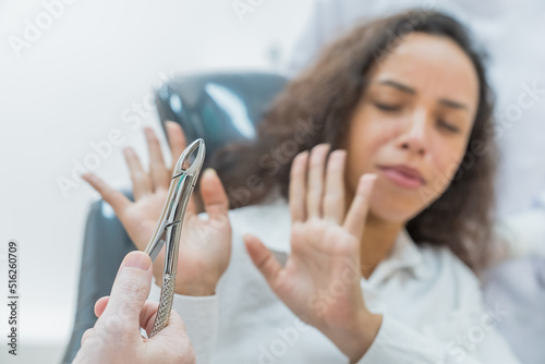 Caucasian woman feel afraid get treatment for Caucasian male dentist. 