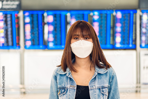 Young beautiful asian woman in quarantine for coronavirus wearing surgical mask face protection with social distancing at city.covid19 concept