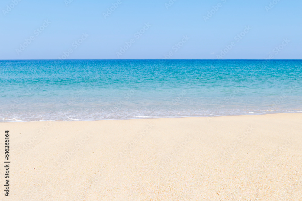 Tropical summer beach background, clean sandy beach with blue sea and clear blue sky, nature concept background, sumer outdoor day light