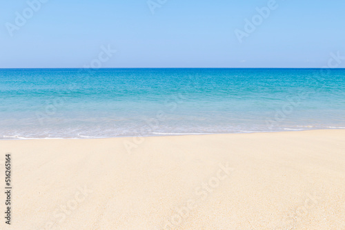 Tropical summer beach background, clean sandy beach with blue sea and clear blue sky, nature concept background, sumer outdoor day light