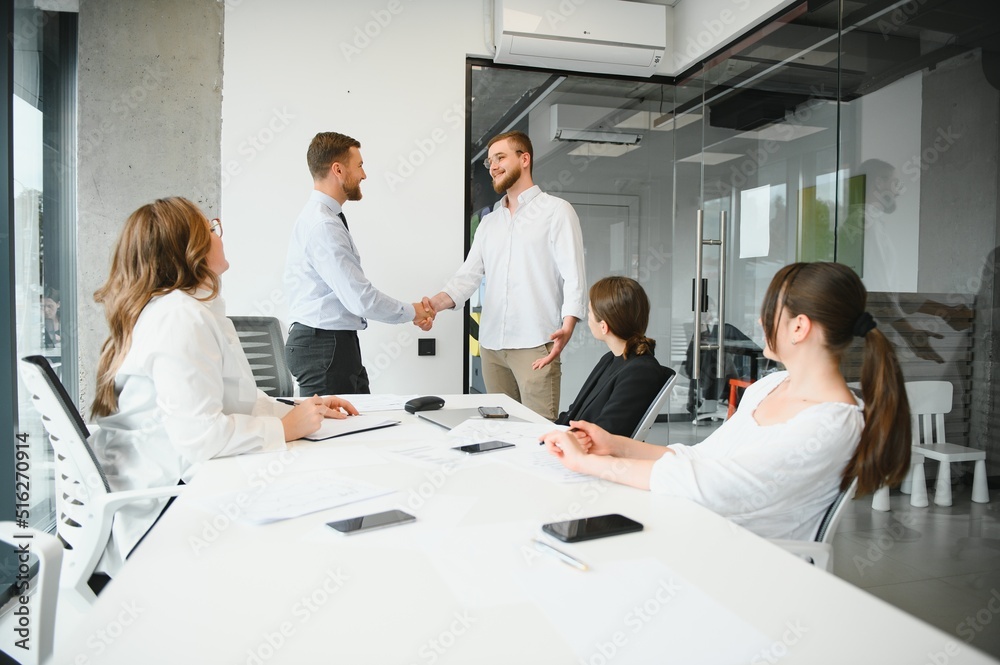 Corporate business team and in a meeting at modern office with big windows . High quality photo Corporate business team and in a meeting at modern office with big windows . High quality photo