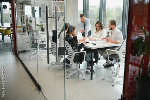 Corporate business team and in a meeting at modern office with big windows . High quality photo