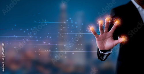 Businessman hand using fingerprint identification to access personal financial data, Fingerprint scan provides security access with biometrics identification. Business technology concept