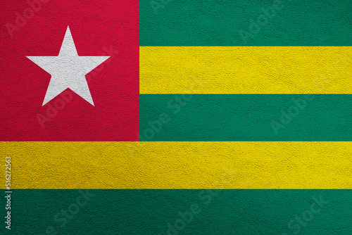 Modern shine leather background in colors of national flag. Togo