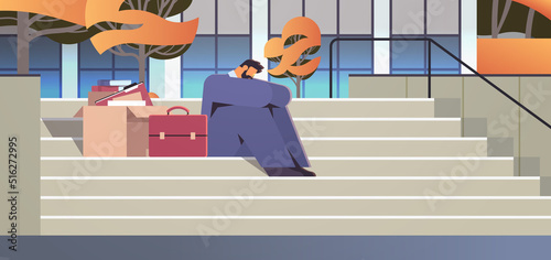 depressed businessman in despair sitting on stairs dismissed business man with things unemployment crisis