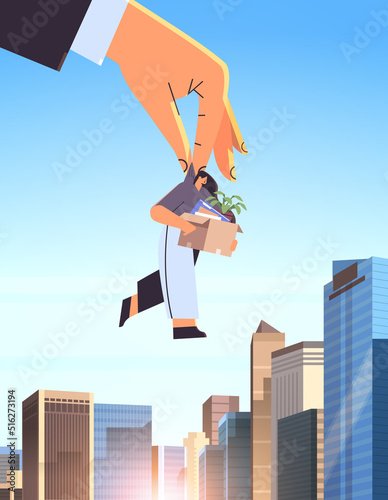 big boss hand holding fired dismissed business woman with things unemployment crisis jobless employee job reduction layoff