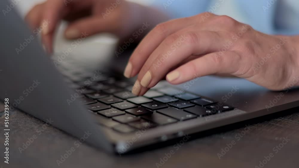 Woman wearing blue business suite working at the office using tablet and notebook Woman wearing blue business suite working at the office using tablet and notebook