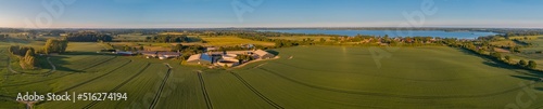 Photography Panorama aerial view of countryside with biogas plant with tanks with liquid manure