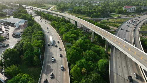 Aerial view of interstate highway system in USA. Traffic on road and freeway.