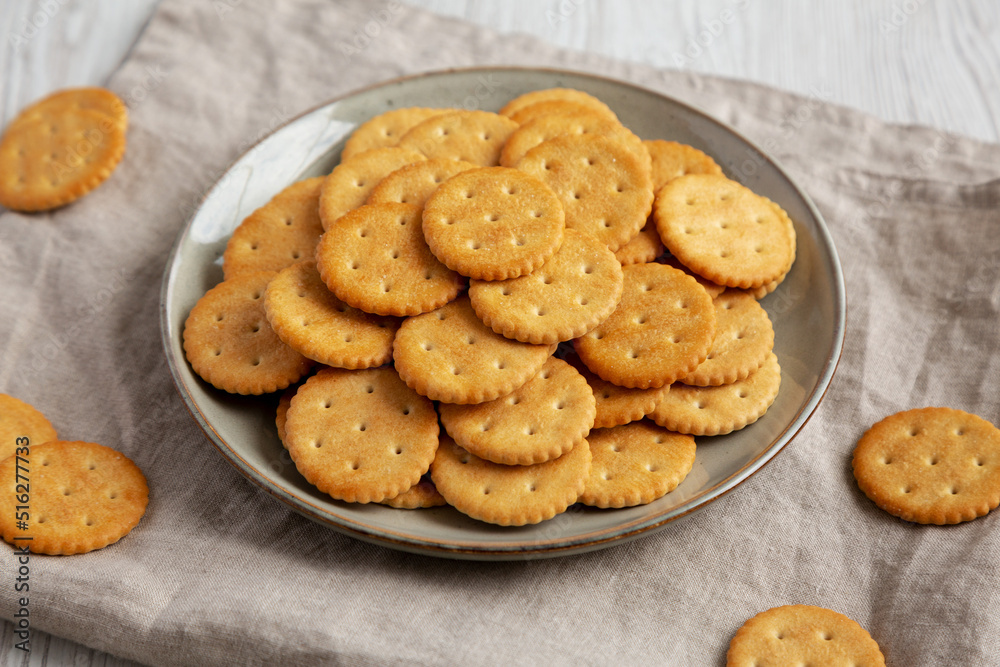 Salty Round Crackers on a Plate, side view. Salty Round Crackers on a Plate, side view.