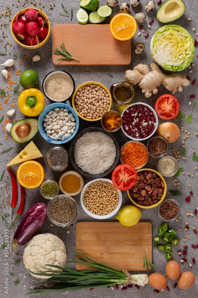 Assortment of healthy food in flat lay. Organic vegetables, fruits, greens, spices, meat, vegetable oil, cereals and nuts Assortment of healthy food in flat lay. Organic vegetables, fruits, greens, spices, meat, vegetable oil, cereals and nuts