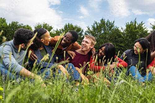 Multiracial Gen Z friends sharing joyful moment - Happy young people community in summer nature park