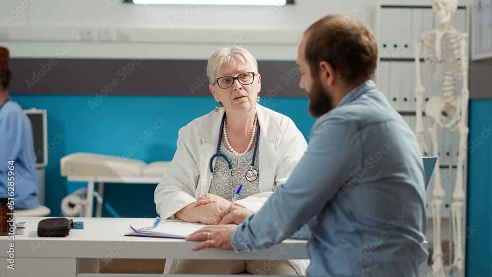 Fototapeta premium Male patient signing checkup appointment report on papers to receive prescription treatment and medicine. Signature on medical diagnosis documents for health care system support in office.
