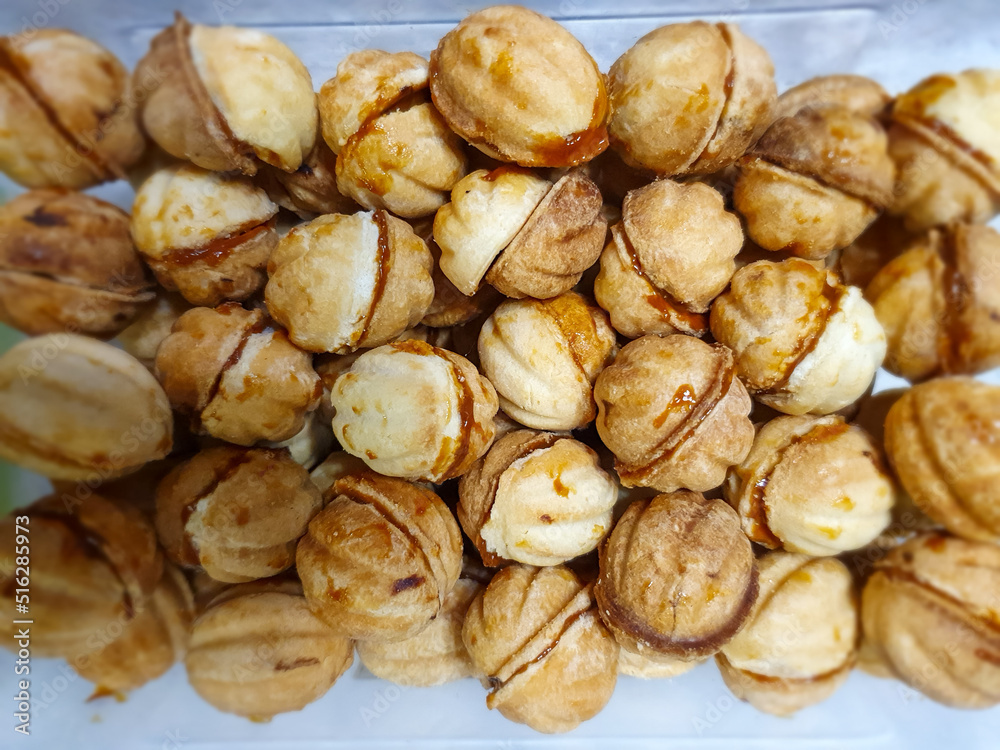 close up of a plate of delicious food, baked nuts with condensed milk close up of a plate of delicious food, baked nuts with condensed milk