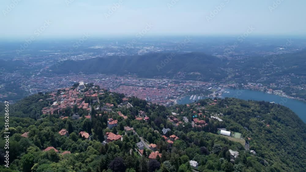 Aerial Flying Over Green Hilltop With Houses Overlooking Lake Como In Italy, Dolly Forward, Tilt Up Shot Aerial Flying Over Green Hilltop With Houses Overlooking Lake Como In Italy, Dolly Forward, Tilt Up Shot
