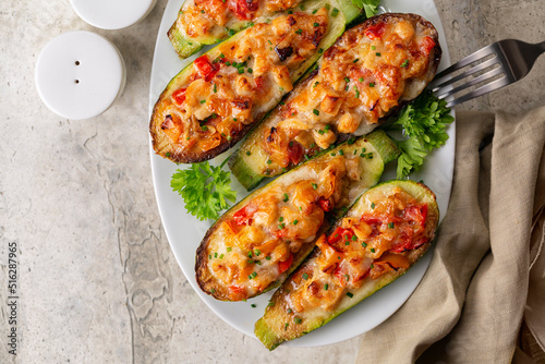 Quadro em tela Zucchini stuffed with chicken meat, belle peppers, tomatoes and cheese