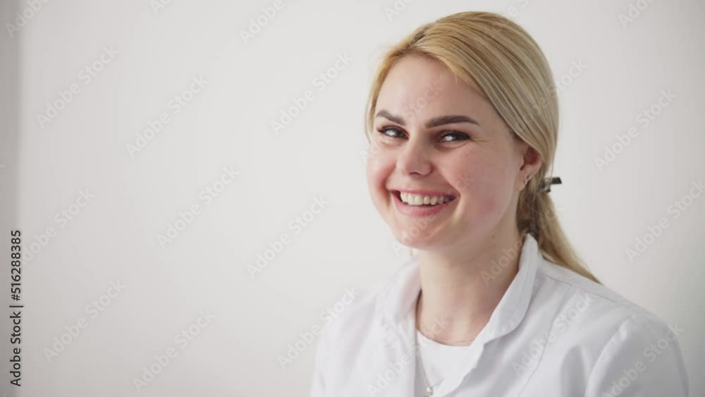 A cosmetologist smoothes out wrinkles with microcurrent. Hardware procedure in cosmetology. Peeling, phonophoresis, massage and face lift in a cosmetic clinic. The doctor accepts in the office.