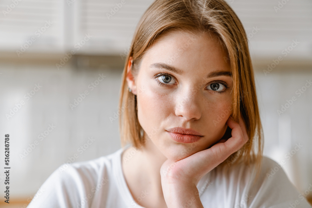 Close up of a young white blonde woman indoors Close up of a young white blonde woman indoors