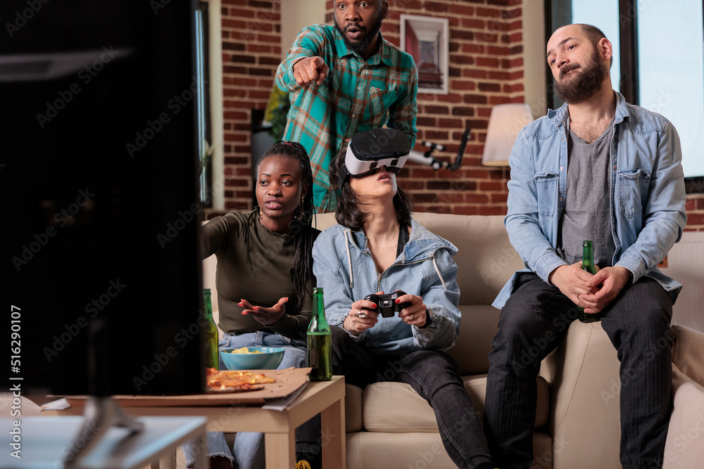 Group of diverse friends playing game on mobile phone Stock Photo