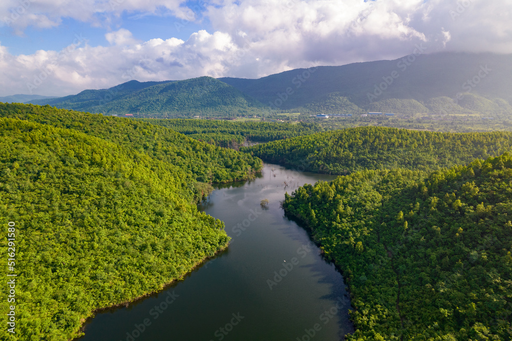 Aerial landscape with green hills, river and forest