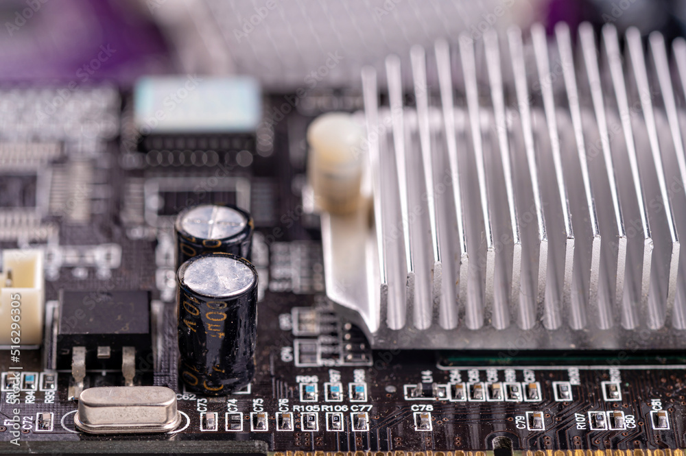 electronic circuit and cooling fin at computer video card, stack with used video cards, closeup electronic circuit and cooling fin at computer video card, stack with used video cards, closeup