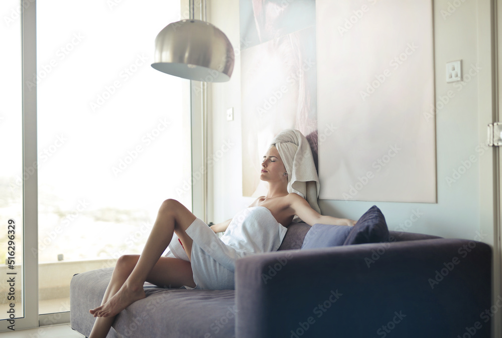 young woman sitting on the sofa relaxes young woman sitting on the sofa relaxes
