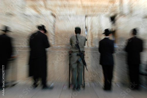 Orthodox Jews and soldier praying at the Kotel  also called Western Wall or wailing wall