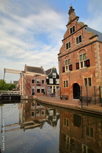 Reflection of the Stadhuis (Town Hall) in De Rijp, Alkmaar, North Holland, Netherlands. The Stadhuis was built in 1630 and nowadays hosts a tourist office. De Rijp is known for its rijksmonuments photo