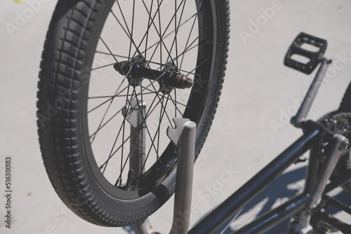 removing a bicycle wheel from a bike close-up during maintenance and servicing