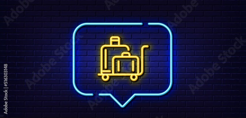 Neon light speech bubble. Luggage trolley line icon. Suitcase bag sign. Baggage claim symbol. Neon light background. Luggage trolley glow line. Brick wall banner. Vector