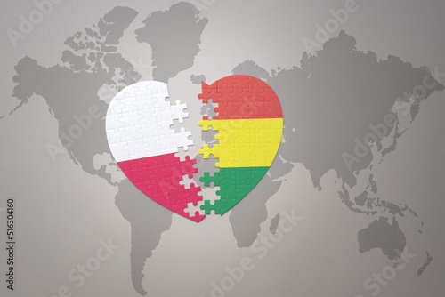 puzzle heart with the national flag of bolivia and poland on a world map background.Concept.