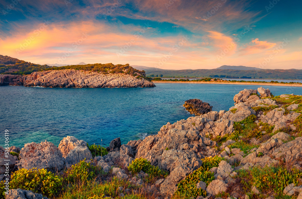 Rocky view of Voidokilia Beach. Stunnig summer seascpae of Ionian sea, Pilos town location, Peloponnese peninsula, Greece, Europe. Vacation concept background.