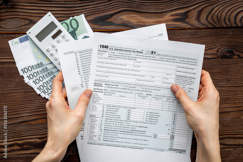 Obraz premium US tax form on office table desktop. Accountant culculate taxes