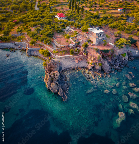 Straight down view from flying drone of Kotronas village. Impressive evening seascape of Mediterranean sea. Calm outdoor scene of Peloponnese peninsula, Greece, Europe. Traveling concept background. © Andrew Mayovskyy