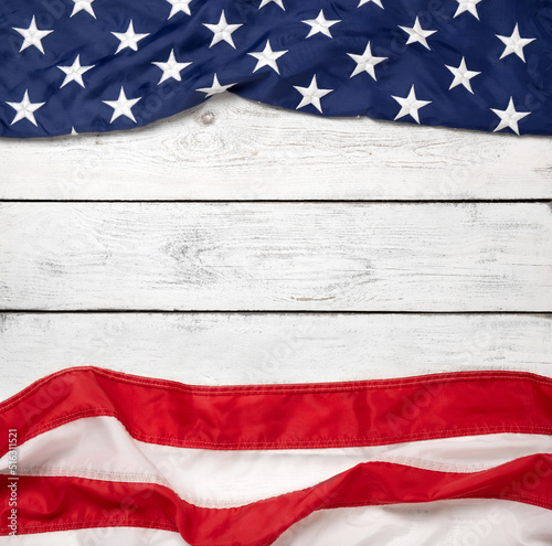 Flat lay USA flag on white wooden board, vintage background with copy space top view. Square format, minimalism. American