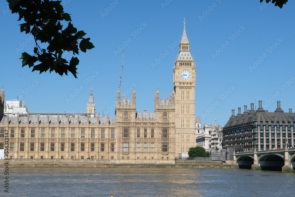 View of London, Houses of Parliament building with Big Ben. British history, Palace of Westminster, river bank.